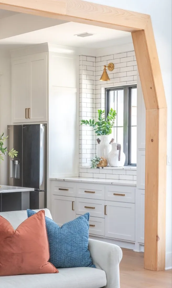 Custom coffee bar built-in cabinets beside a window in Maumelle, AR