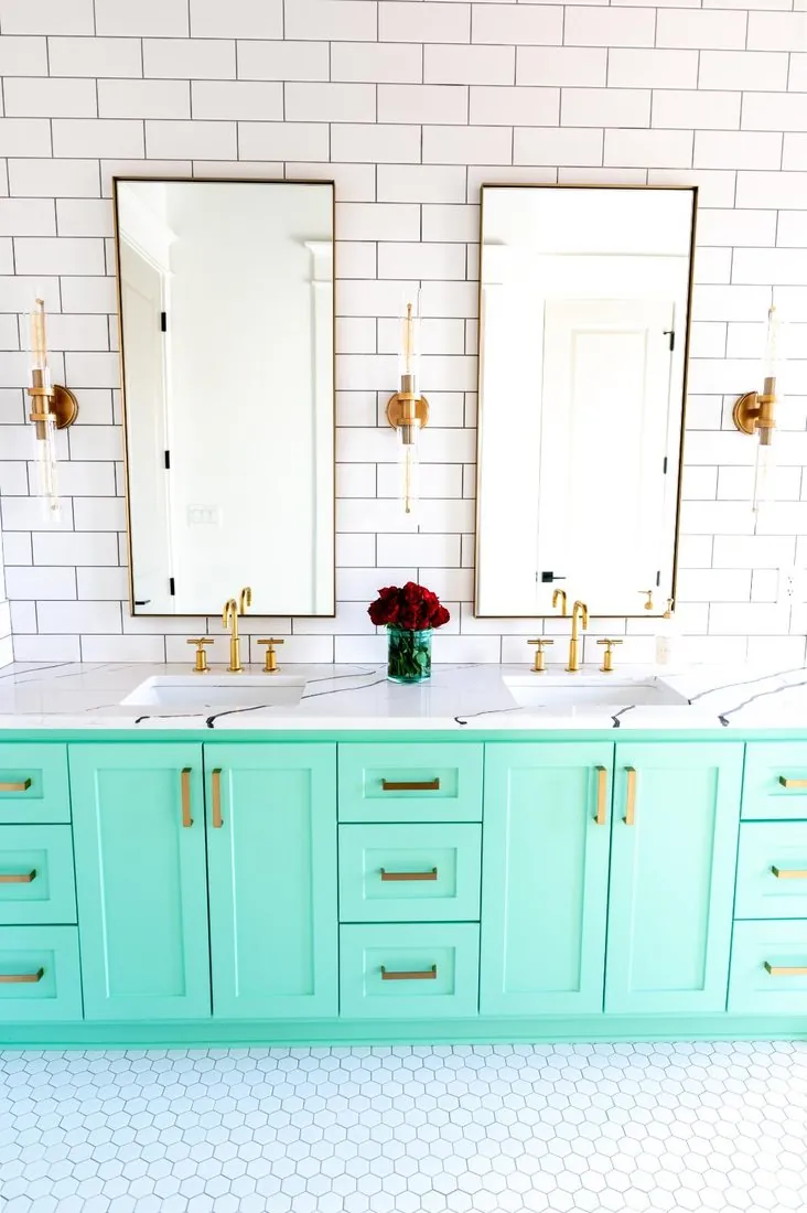 Custom mint green double bathroom vanity with brass fixtures in Benton, AR